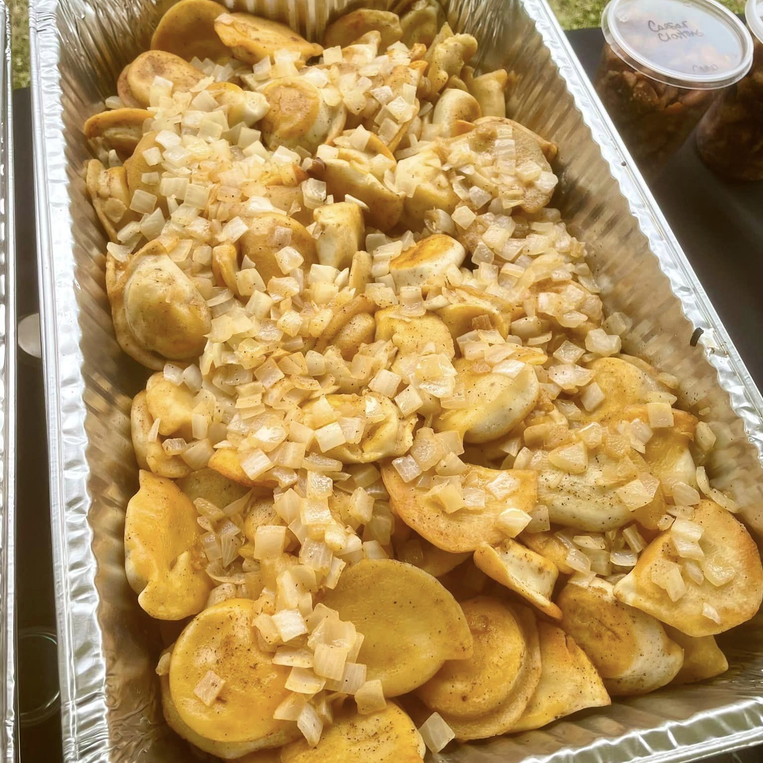 Pierogies sauteed in butter & onions